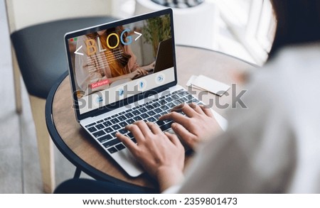 Woman ues laptop computer with social media online content, freelance worker, working online, content creator, blogger, technology, website, woman reading blog online on computer at home Royalty-Free Stock Photo #2359801473