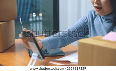 Asian young business woman working selling online. Surprise and shock face of asian woman success on making sale online shopping.