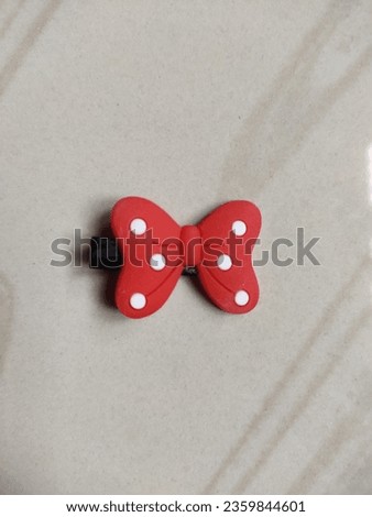 Red colour Butterfly clip for babies  Royalty-Free Stock Photo #2359844601