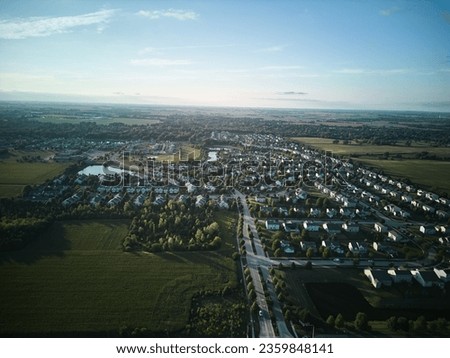 Above aerial wide photo of residential houses and yards in suburb. Real estate photo