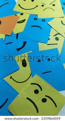 Some smiles are drawn in paper.