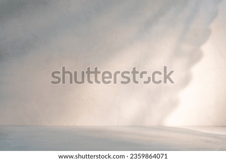 Cozy home neutral minimalist rustic background with low sunlight and soft shadows from openwork curtain Royalty-Free Stock Photo #2359864071