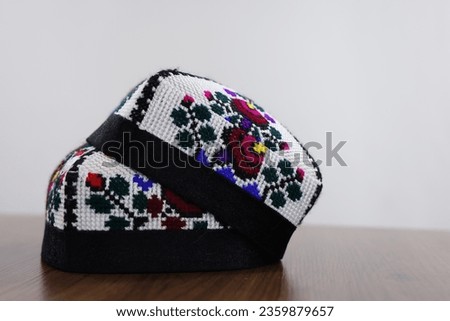 Uzbek traditional hat with embroidery on a white background Royalty-Free Stock Photo #2359879657