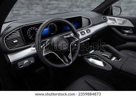 car Interior - steering wheel, shift lever and dashboard, climate control, speedometer, display. Salon of a new stylish car
 Royalty-Free Stock Photo #2359884873