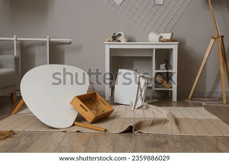 Workplace with decor in messy living room Royalty-Free Stock Photo #2359886029