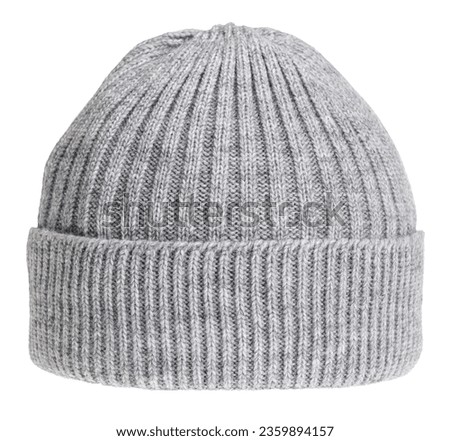 Gray knitted winter bobble hat of traditional design isolated on white background