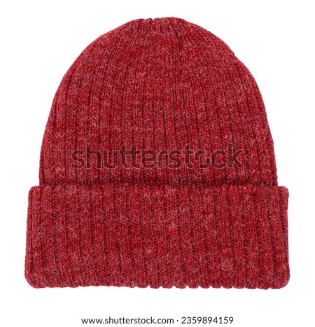 Red knitted winter bobble hat of traditional design isolated on white background Royalty-Free Stock Photo #2359894159