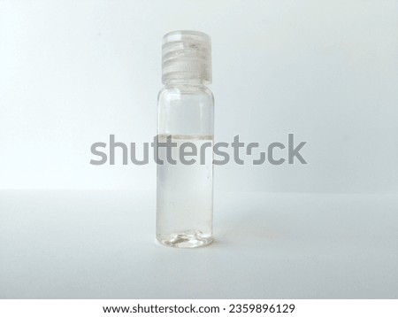 coconut oil in a transparent bottle on a white background.  medicine for cats affected by fungus, scabies, made from virgin coconut oil, contains lauric acid and polyphenols as antioxidants