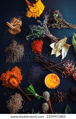 Spices and herbs. Variety of spices and mediterranean herbs. Food background Royalty-Free Stock Photo #2359911803