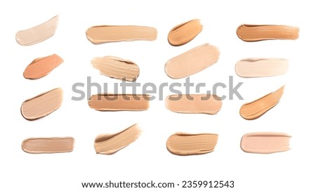 Foundation of different textures and shades for various skin types isolated on white. Set with samples of makeup product Royalty-Free Stock Photo #2359912543