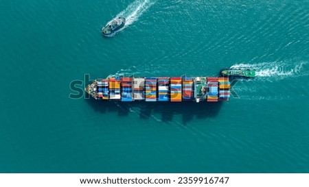 Top view of cargo container ship carrying container and running with tug boat for import export goods from cargo yard port to custom ocean concept freight shipping by ship.