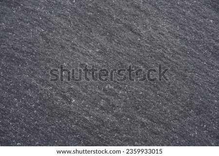 Old, rough, dark gray, rustic concrete grunge background texture wallpaper, design with copy space, rock, slate or stone high resolution. Image of rough dark gray asphalt.