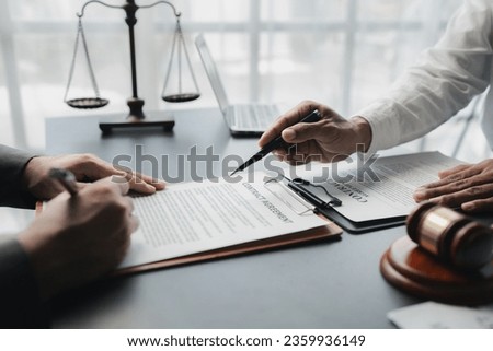 Lawyers give advice to clients and draft contracts. Lawyers seek legal information to plan for representing clients in cases and draft case employment contracts, using the law. Lawyer concept. Royalty-Free Stock Photo #2359936149
