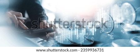 Business, finance and investment, currency exchange concept. Accountant using calculator with coins and financial report, economic graph growth, world currency, finance background Royalty-Free Stock Photo #2359936731