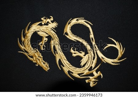Golden dragon embroidery on a black fabric