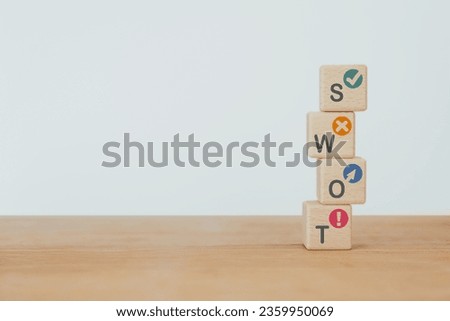 SWOT analysis and strategic planning technique concept. SWOT words means Strengths, Weaknesses, Opportunities and Threats on stack of wooden cube blocks including copy space