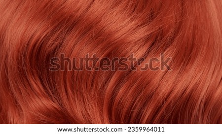 Close-up view of natural shiny red-haired hair, bunch of ginger curls background Royalty-Free Stock Photo #2359964011