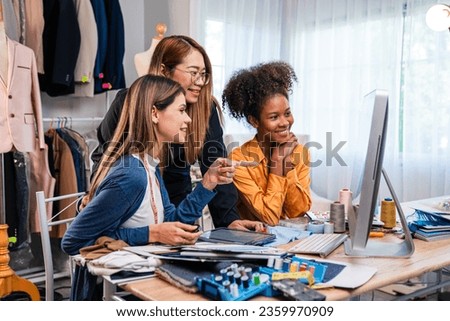 Fashion design concept, young stylish woman fashion designer working in studio office, small business owner creating new fashion design cloth in atelier.