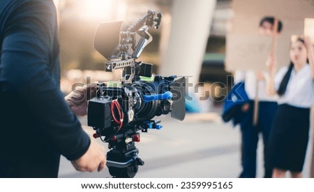 Concept shooting equipment of filming advertising with a video camera movie and TV commercial, behind the scenes movie shooting video production outdoor nature background