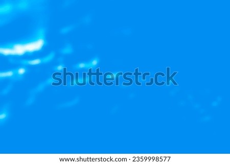 White ripples spreading from the upper left on a blue background.