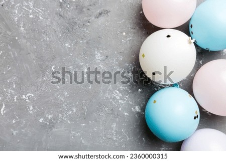 Background with fastive air balloons of round shape and confetti, multicoloured top view. Birthday party background.