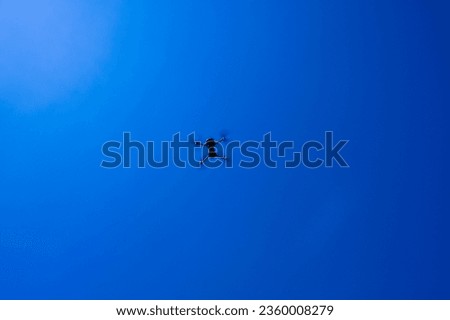 Drone on sky blue background isolated. Copy space.