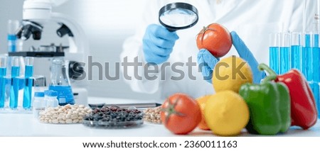 Scientist check chemical fruit residues in laboratory. Control experts inspect the concentration of chemical residues. hazards, standard, find prohibited substances, contaminate, Microbiologist Royalty-Free Stock Photo #2360011163