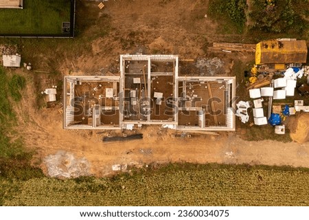 Drone photography of a large construction site with lots of machinery during summer day