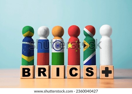 Brazil Russia India China and South Africa flag print screen on wooden figure with plus sign for many countries need to participate to BRICS economic international cooperation concept.