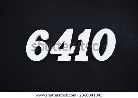 Black for the background. The number 6410 is made of white painted wood.