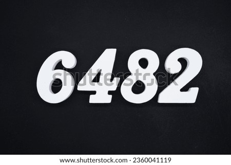 Black for the background. The number 6482 is made of white painted wood.