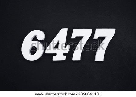 Black for the background. The number 6477 is made of white painted wood.