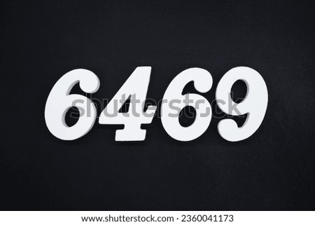Black for the background. The number 6469 is made of white painted wood.