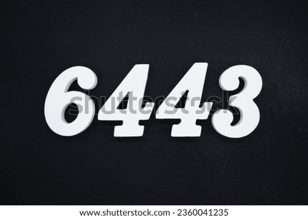 Black for the background. The number 6443 is made of white painted wood.
