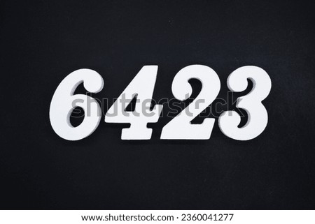 Black for the background. The number 6423 is made of white painted wood.