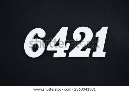Black for the background. The number 6421 is made of white painted wood.