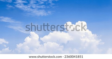 a photography of a plane flying in the sky with clouds in the background, golf ball in the air with clouds in the background.