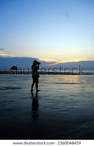 Sunset in Tioman with silhouet of a photographer and tree