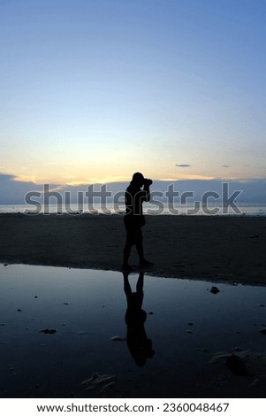 Sunset in Tioman with silhouet of a photographer and tree