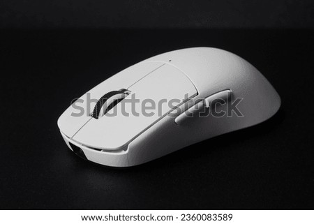 White mouse computer gaming closeup on black background Royalty-Free Stock Photo #2360083589