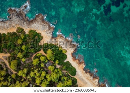 Rocky jagged shoreline and blue turquoise sea seen form drone during sunny day aerial photography Sa Coma Mallorca Spain Royalty-Free Stock Photo #2360085945
