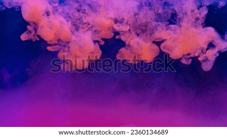 colorful smoke on dark background Motion Color drop in water,Ink swirling in ,Colorful ink abstraction.Fancy