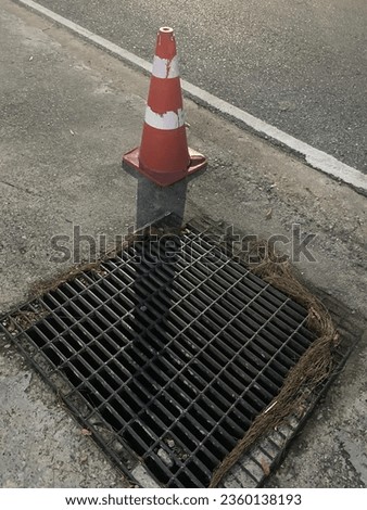 Roadside drains with safety barriers