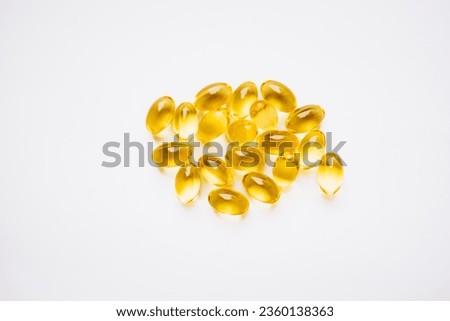 yellow capsules on a white background. medicines and vitamins
