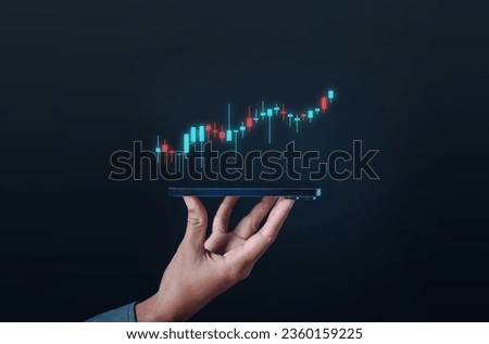investment, graph, cryptocurrency, bitcoin, indicator, hand, investing, trader, risk, diagrams. hold smartphone via fingertips. then upper that's candlestick chart of investment cryptocurrency showing Royalty-Free Stock Photo #2360159225