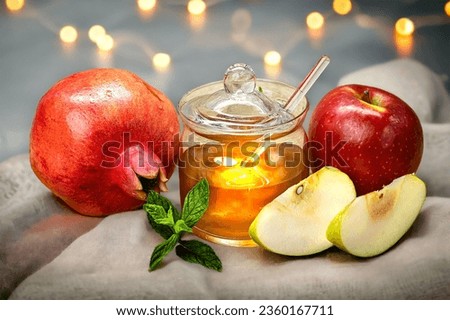 Rosh Hashanah. Pomegranate, apple and honey, traditional food for Jewish New Year celebration, Rosh Hashanah.