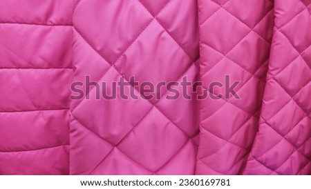 Sample of quilted textile pink color close up texture