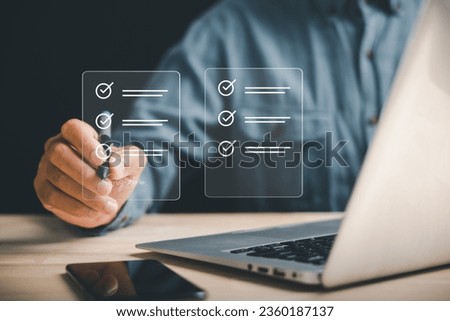 Professional businessman utilizes pen to sign electronic documents on virtual screen. Showcases paperless office concept, e-signing, and effective document management. Agreement is established.