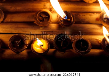 Closeup Group of burning candles in thai style.