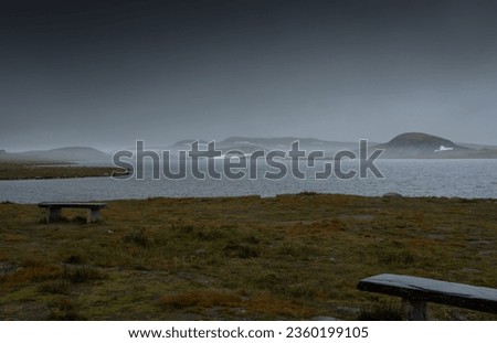 Foggy and rainy Lake landscape in Norway